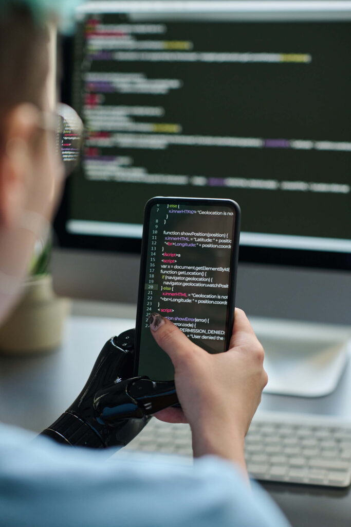 developer-holding-phone-viewing-code-in-office-2026-01-08-00-15-35-utc_sheensol-technologies